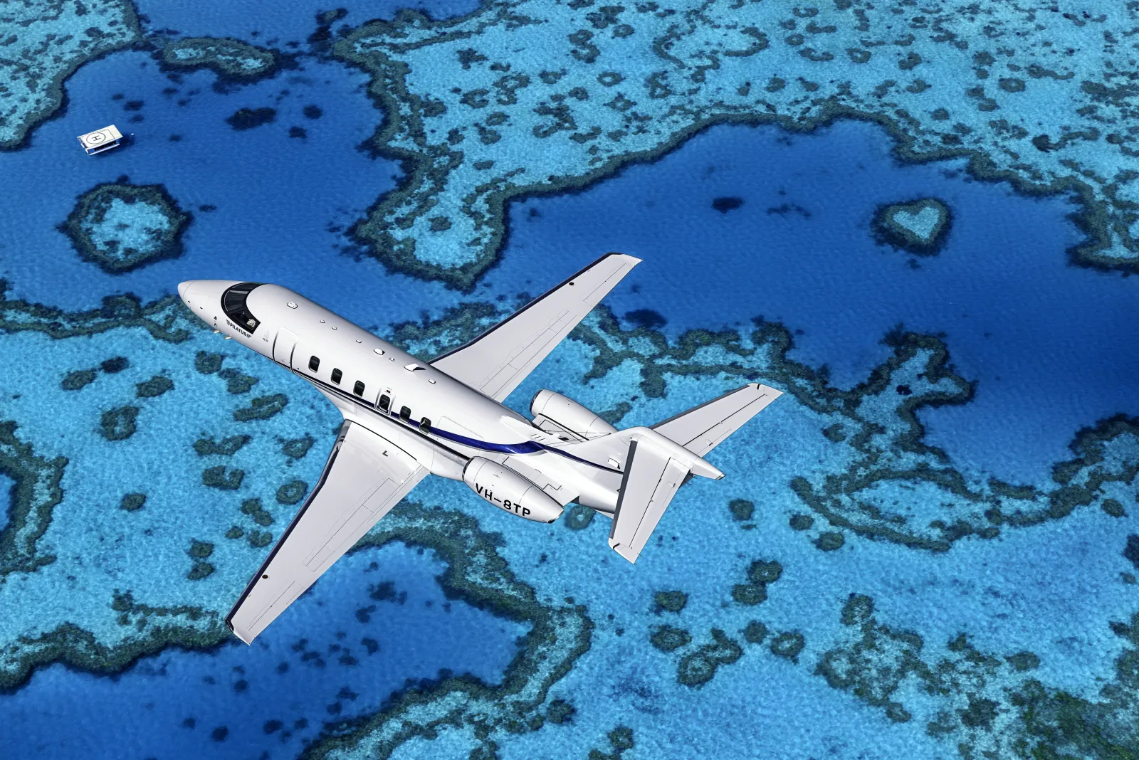 Pilatus PC-24 im Flug über dem Great Barrier Reef